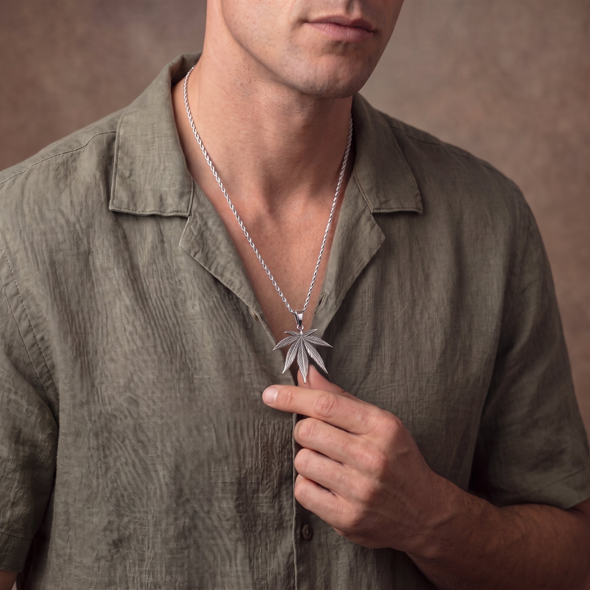 Marijuana leaf silver pendant
