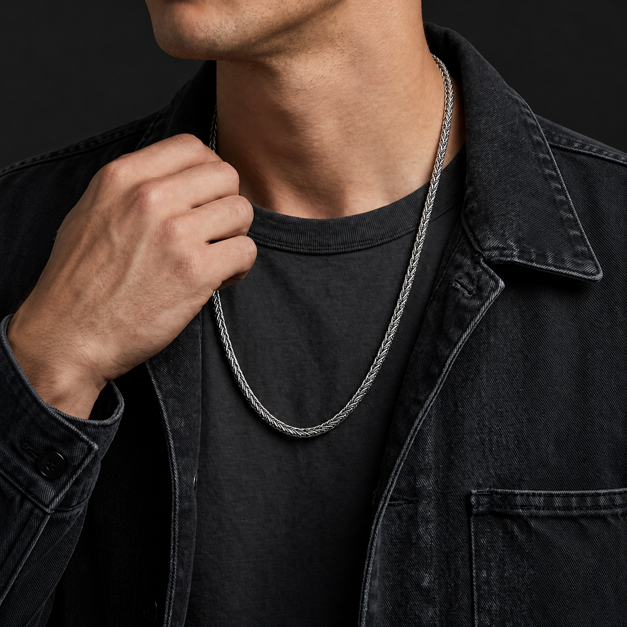 Long sterling silver Braid Chain necklace worn over a charcoal shirt with a dark denim jacket