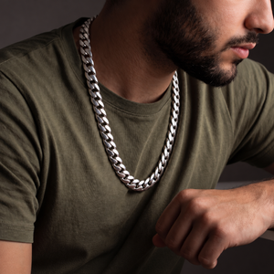 Man wearing a sterling silver High Class Chain necklace over an olive green shirt