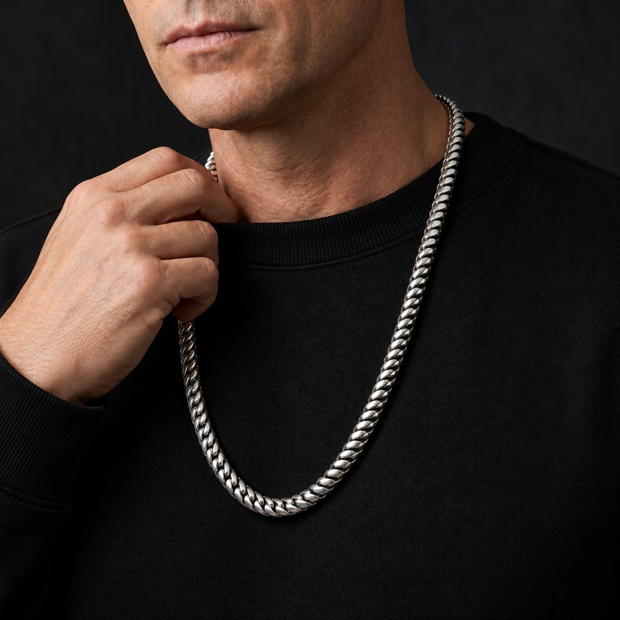 Man wearing a sterling silver Snake Chain necklace over a black shirt
