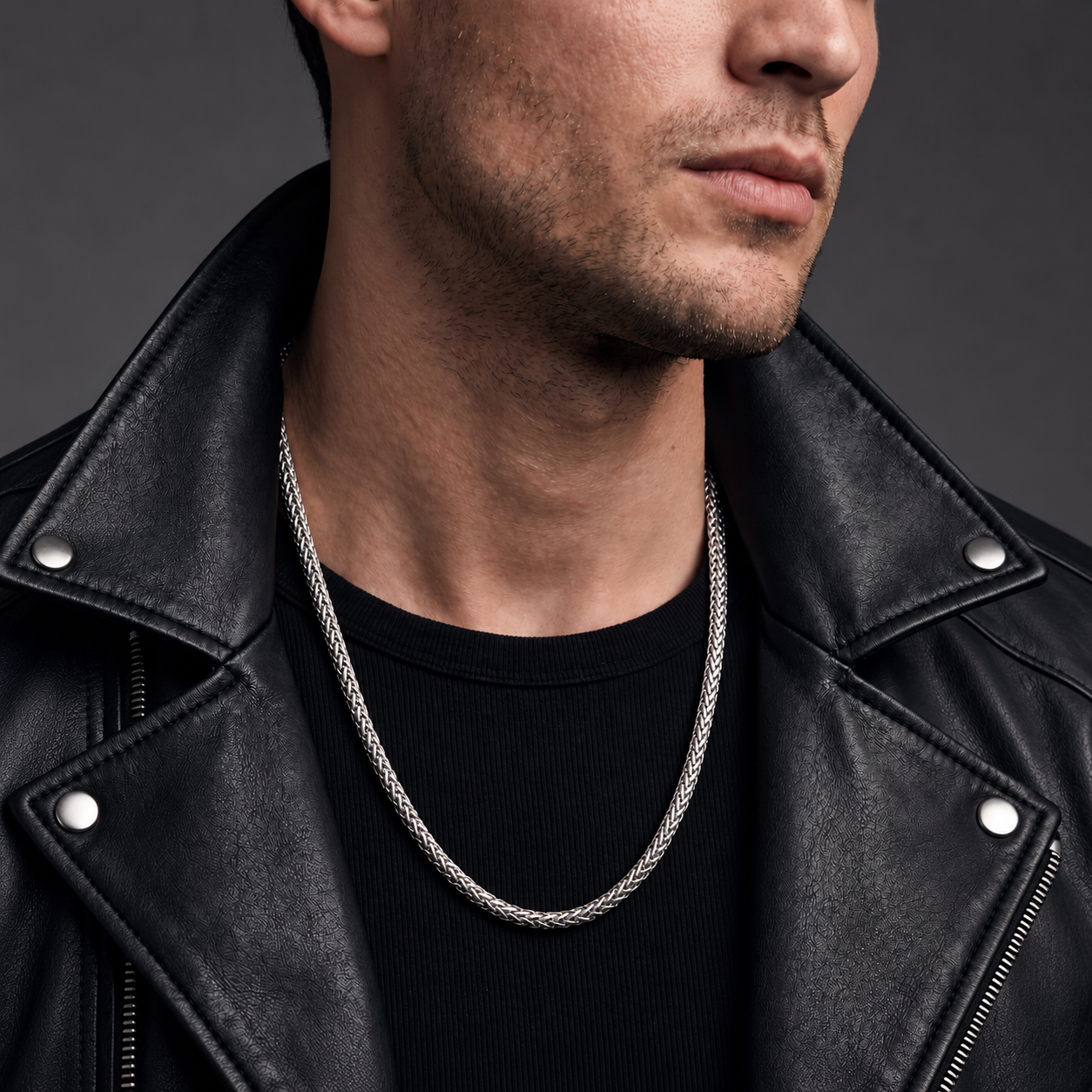 Long sterling silver Sterling Lasso necklace worn with a black leather jacket