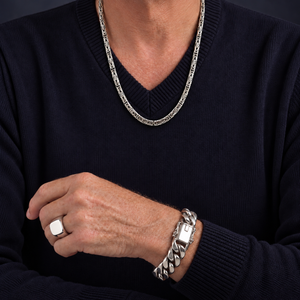 Sterling silver Woven Rope Byzantine necklace worn with a navy V-neck sweater
